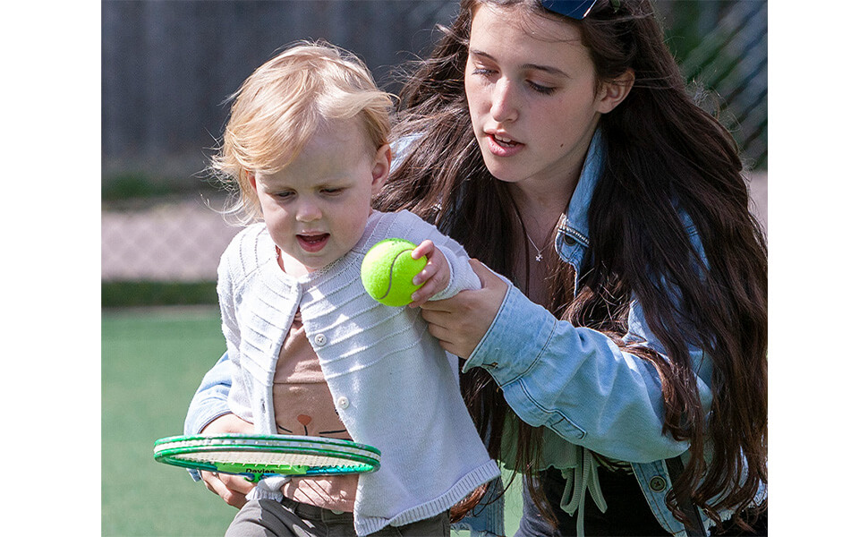 mum and bay learning tennis